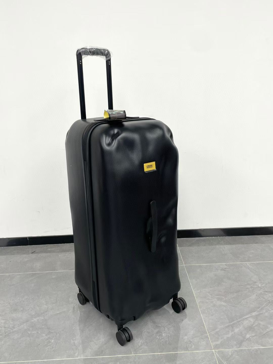 Black Spinner Carry-On Luggage with Yellow Accent Strap