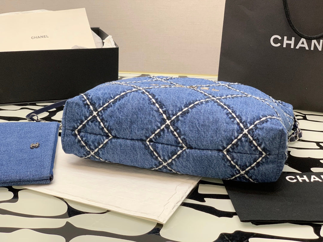 Chanel Quilted Denim Drawstring Bag with Silver-Tone Chain