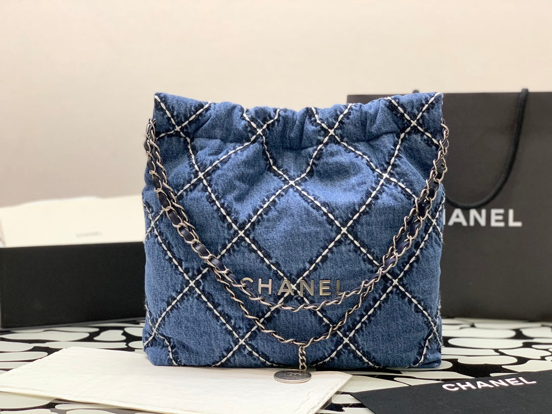Chanel Quilted Denim Drawstring Bag with Silver-Tone Chain