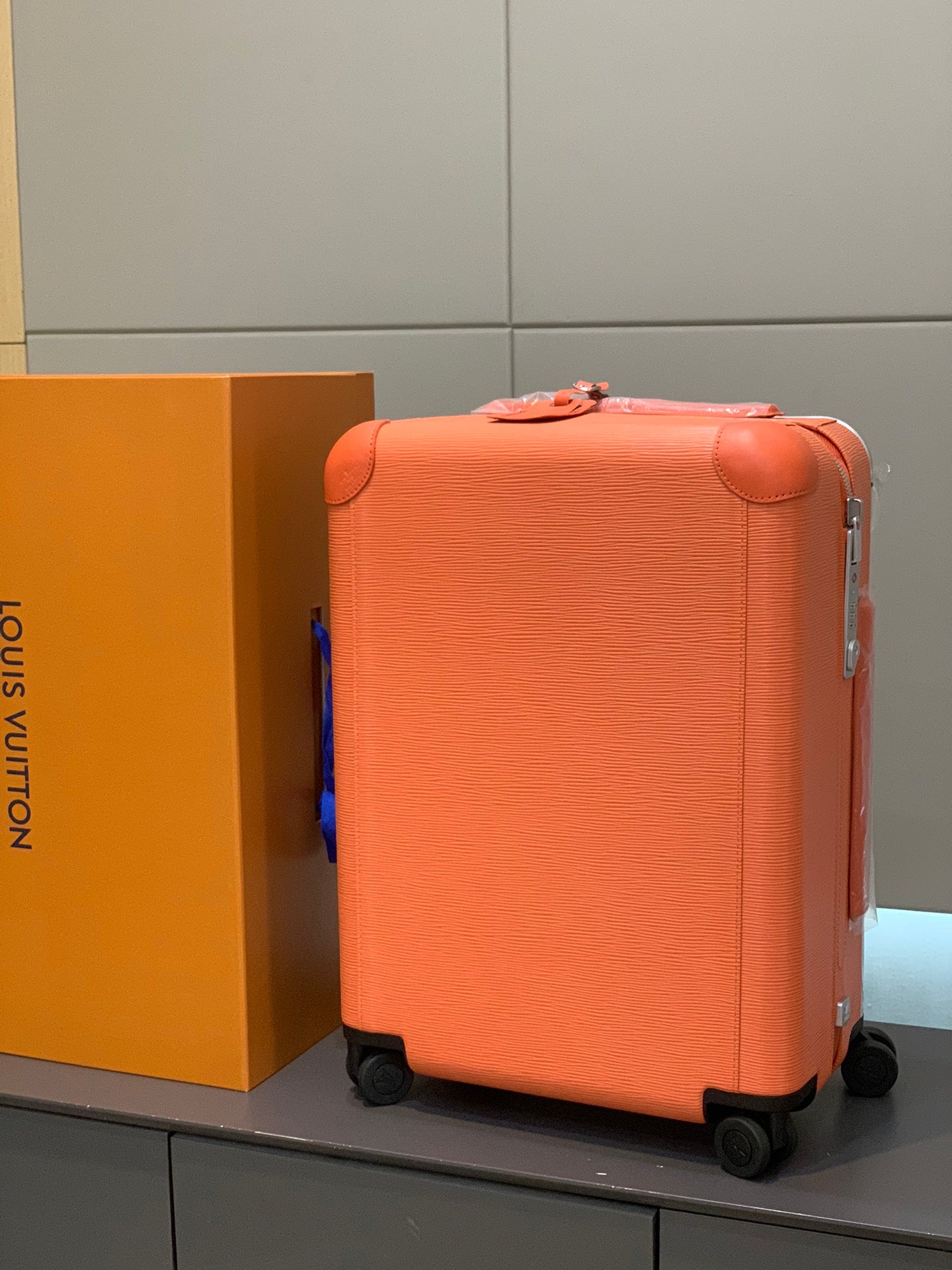 Orange Textured Leather Rolling Suitcase Luxury Carry-On Spinner Luggage
