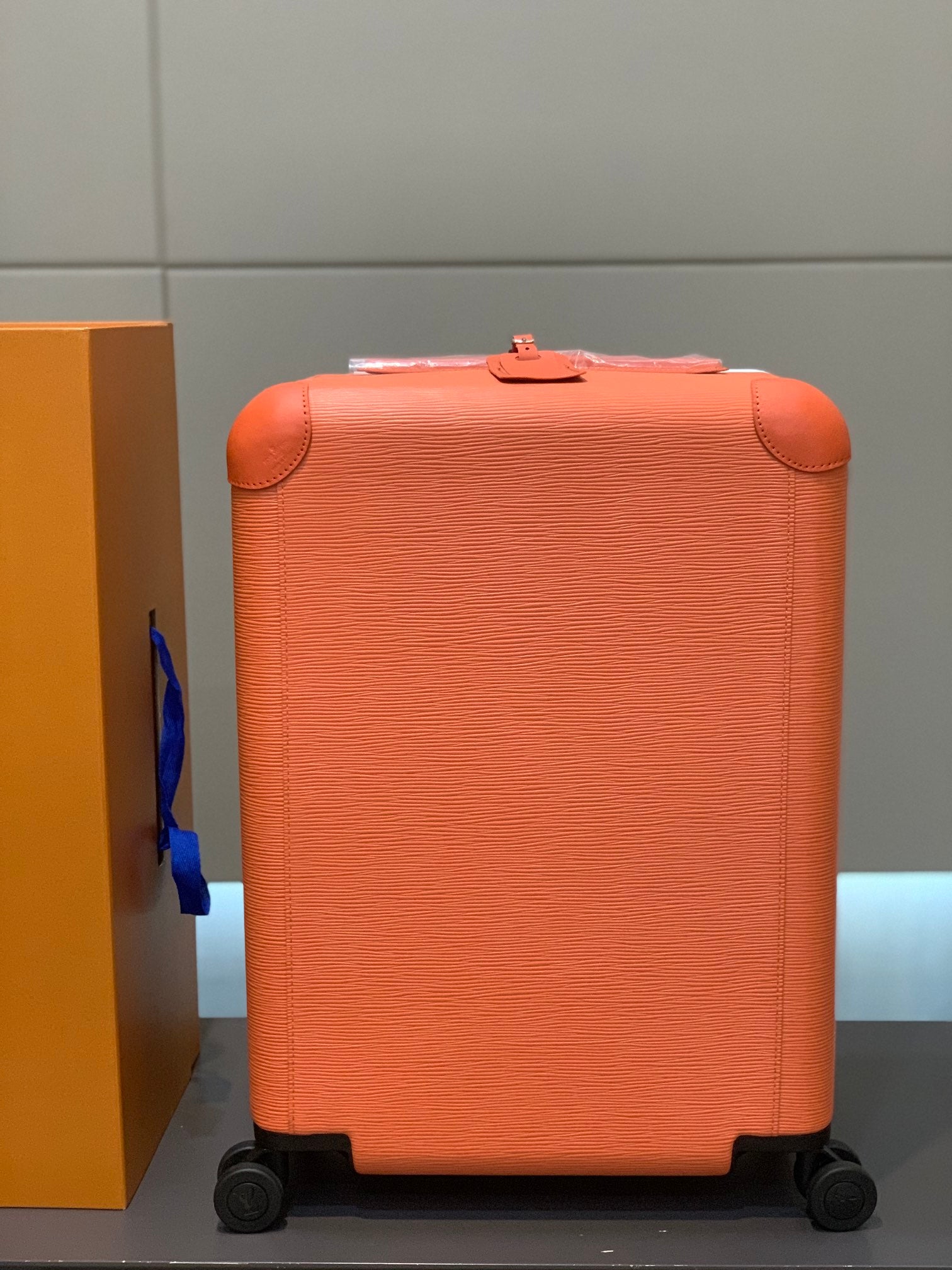 Orange Textured Leather Rolling Suitcase Luxury Carry-On Spinner Luggage