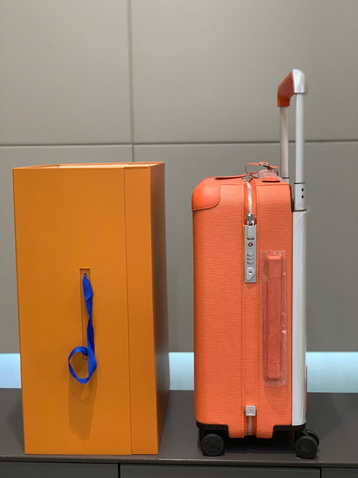 Orange Textured Leather Rolling Suitcase Luxury Carry-On Spinner Luggage
