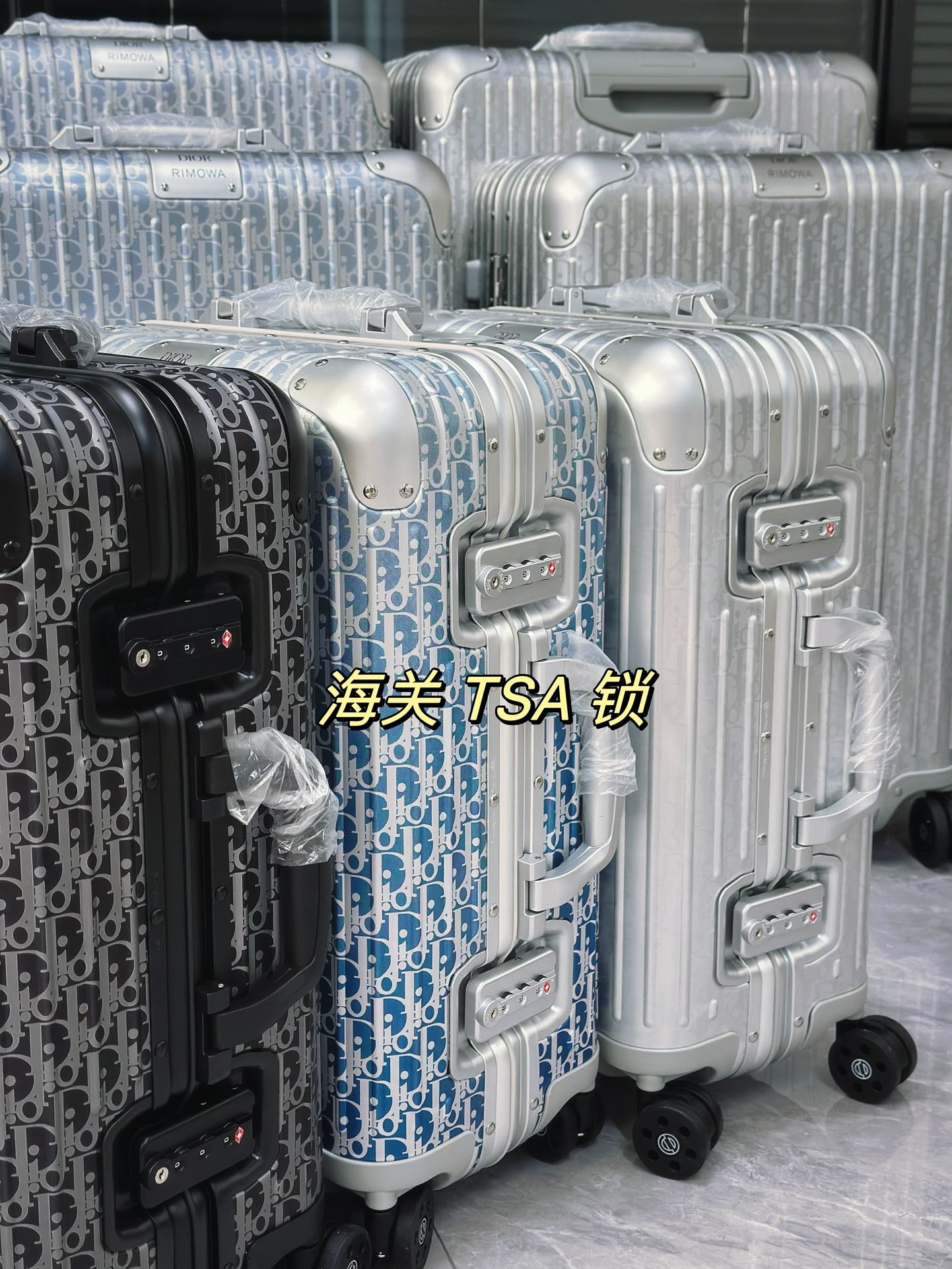 Silver Aluminum Hardside Spinner Suitcase with Monogram Pattern