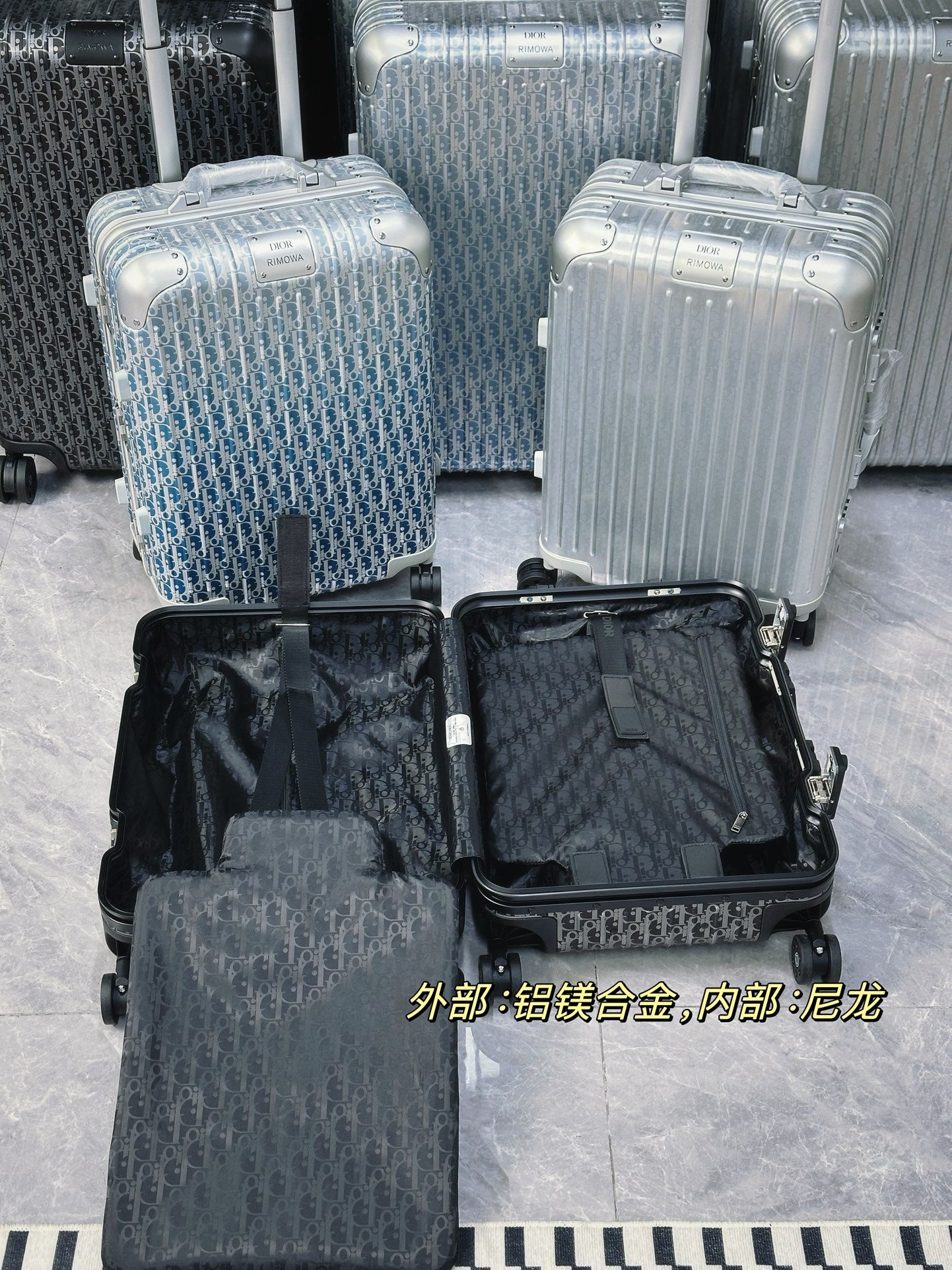Silver Aluminum Hardside Spinner Suitcase with Monogram Pattern