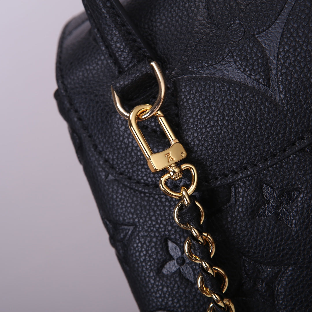 Louis Vuitton Luxury Black Embossed Leather Backpack with Gold Buckles
