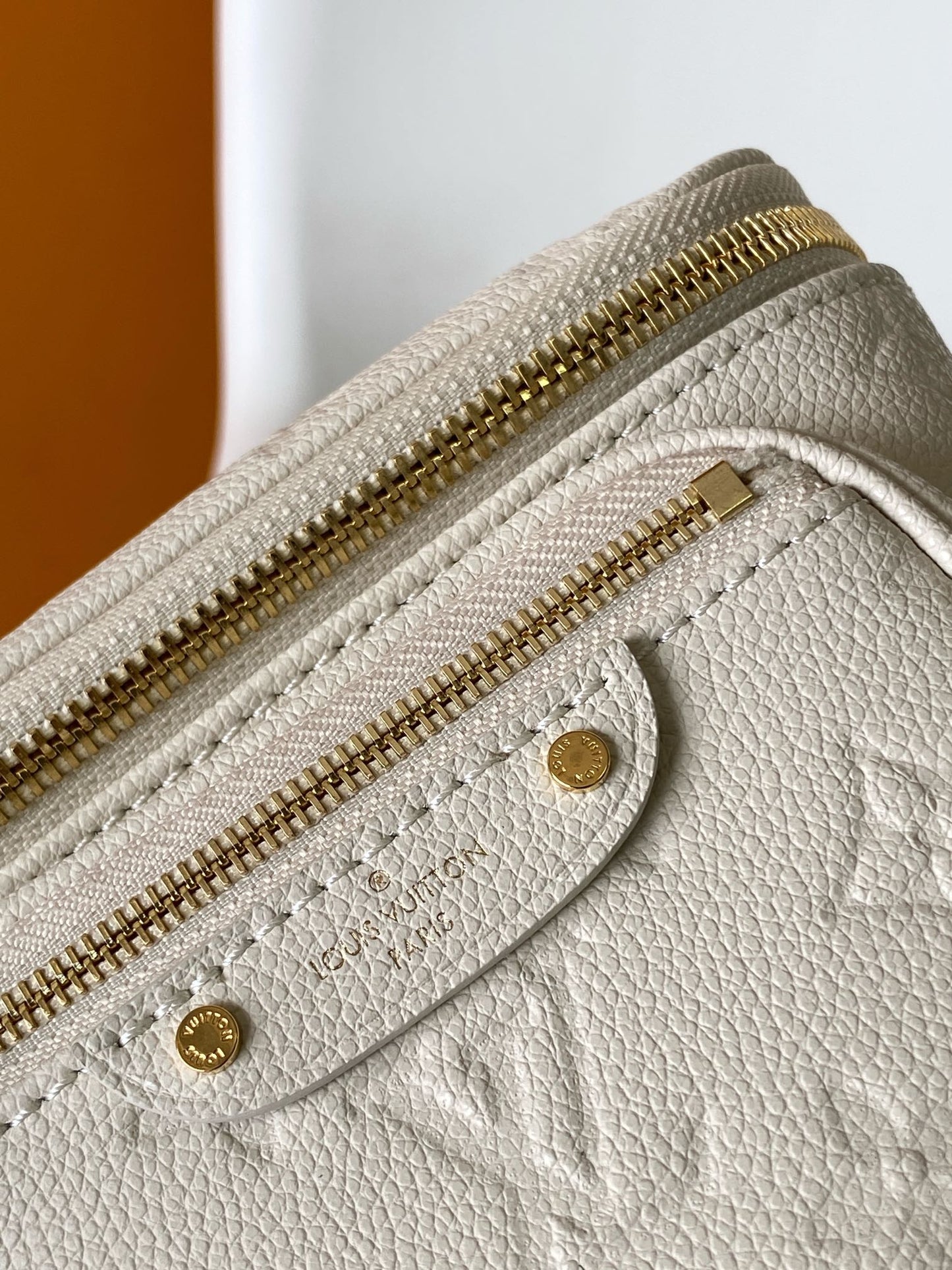Louis Vuitton Elegant Cream Embossed Leather Crossbody Bag with Gold Chain