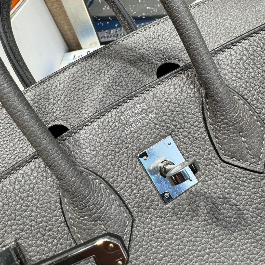 Luxury Grey Leather Top-Handle Handbag with Tan Flap and Silver Hardware