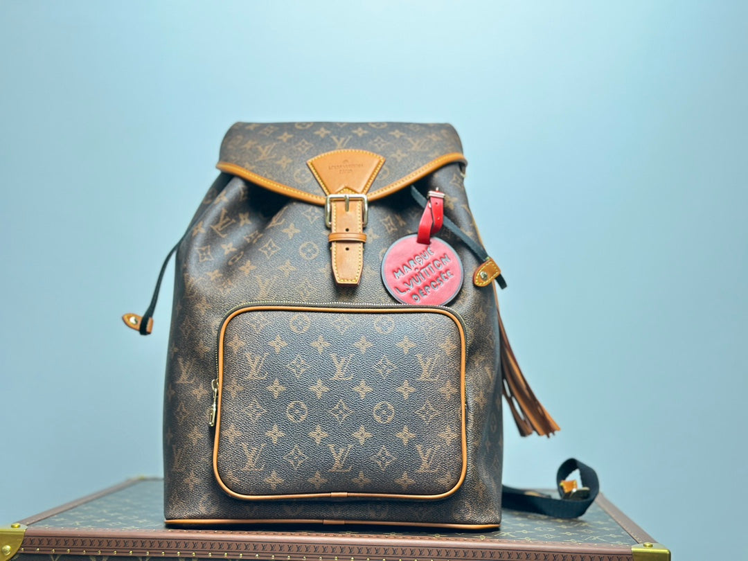 Louis Vuitton Vintage Monogram Pattern Leather Backpack with Buckle and Tassel
