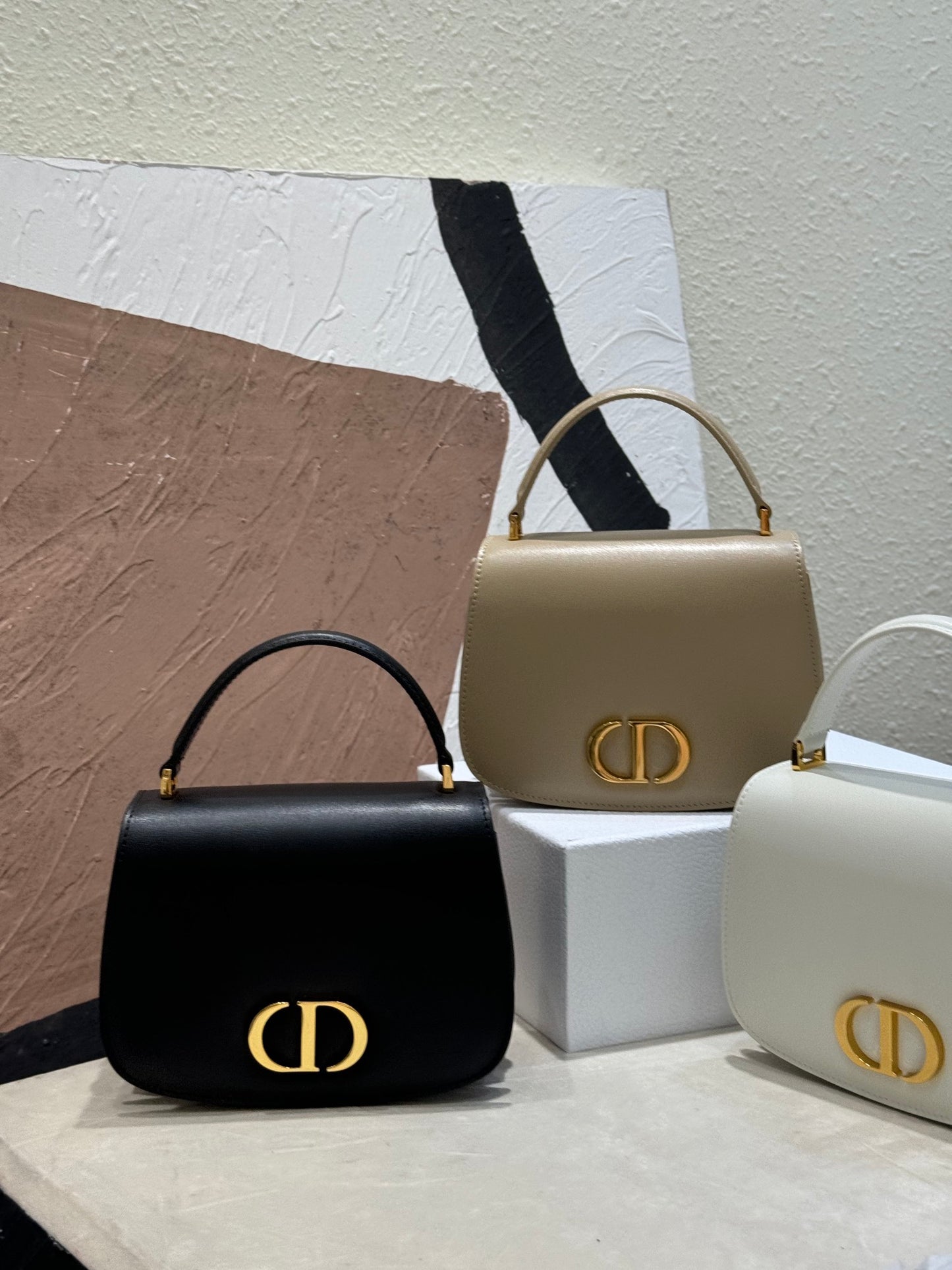 Dior Elegant Structured Leather Handbag with Top Handle and Gold Clasp