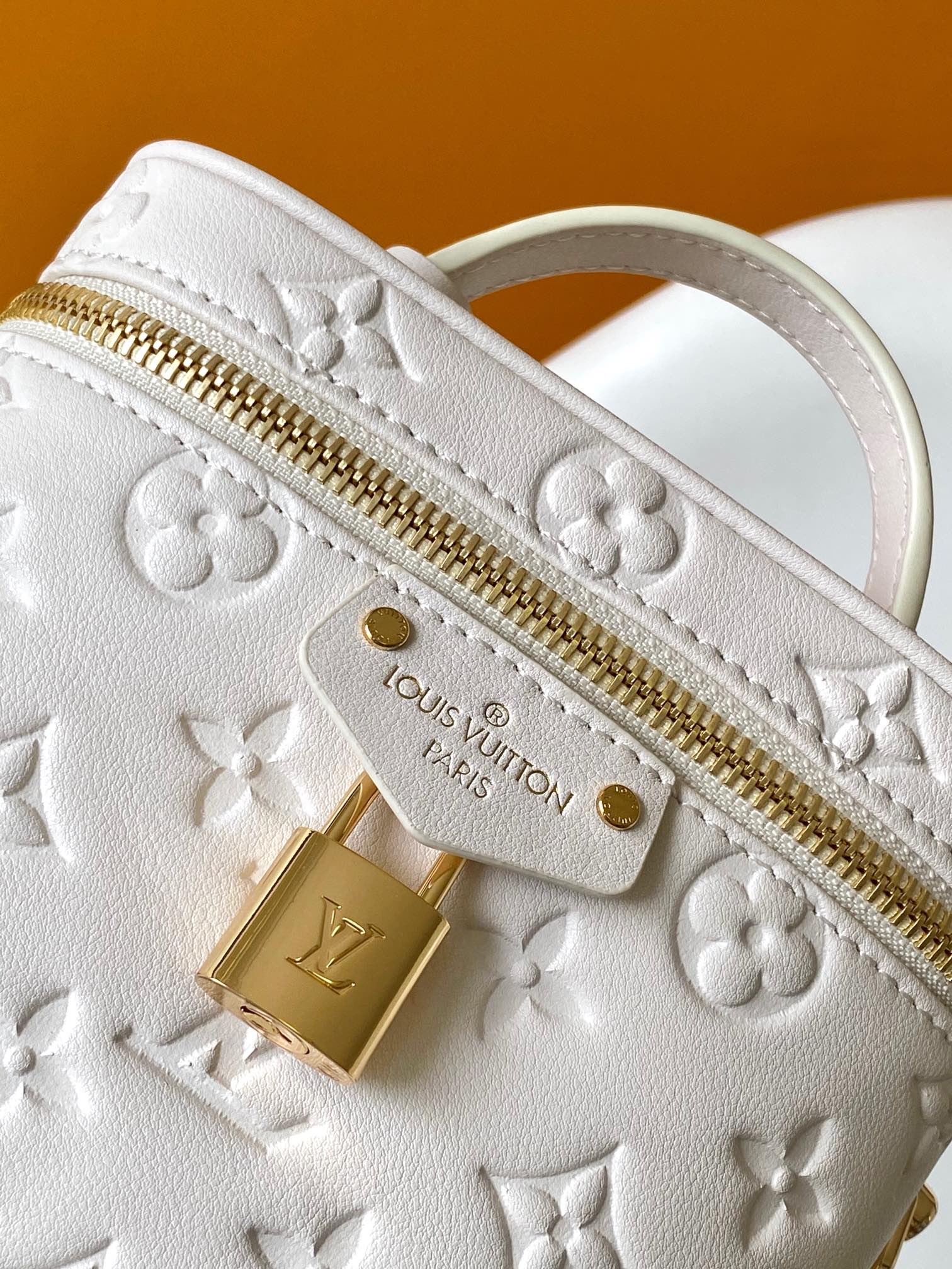 Louis Vuitton Elegant Off-White Embossed Leather Vanity Case Handbag