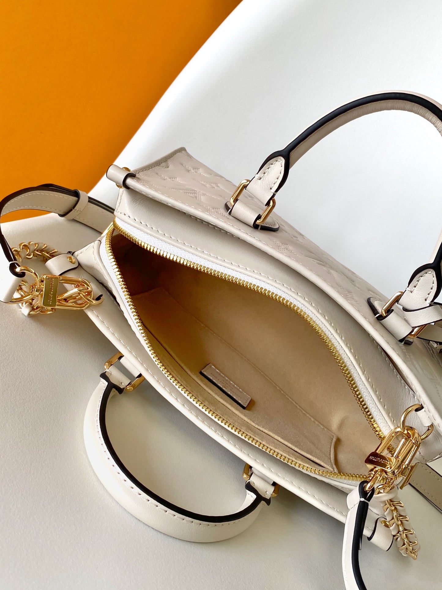 Louis Vuitton Petit Palais Monogram Empreinte Leather Handbag - White