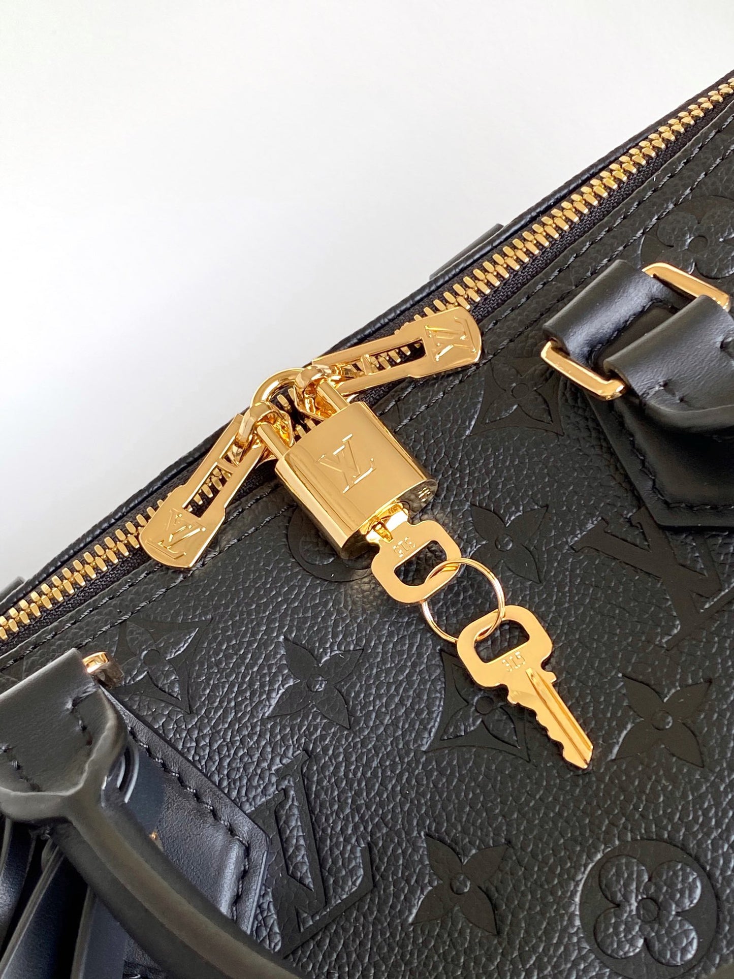 Louis Vuitton Black Embossed Leather Duffle Bag with Top Handles and Strap