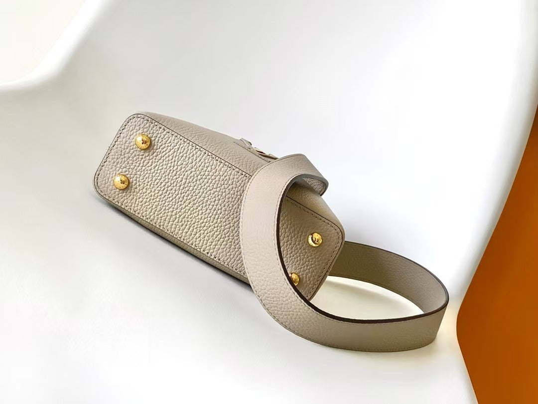 Louis Vuitton Luxury Beige Leather Top Handle Bag with Python Print Accents
