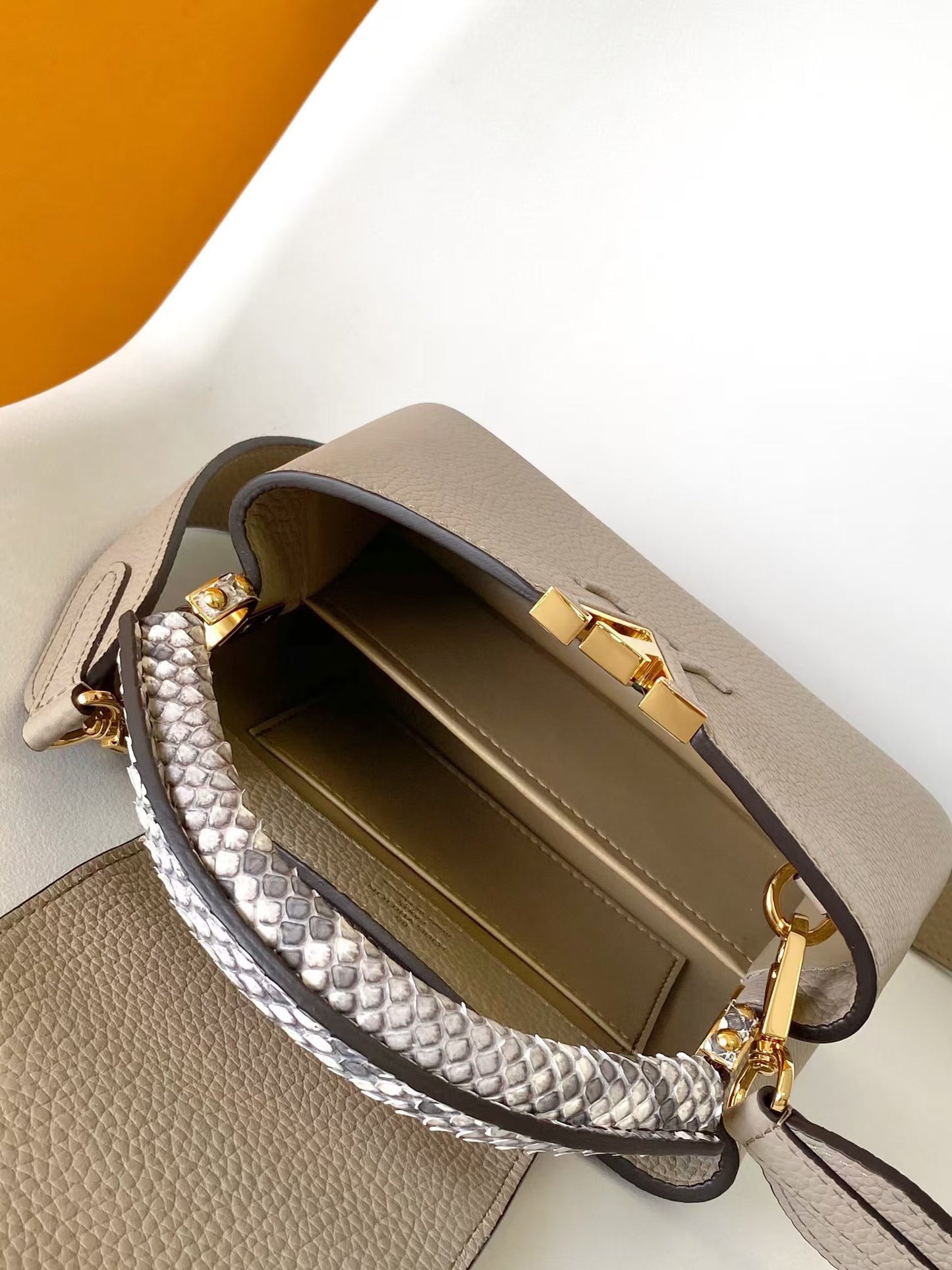 Louis Vuitton Luxury Beige Leather Top Handle Bag with Python Print Accents