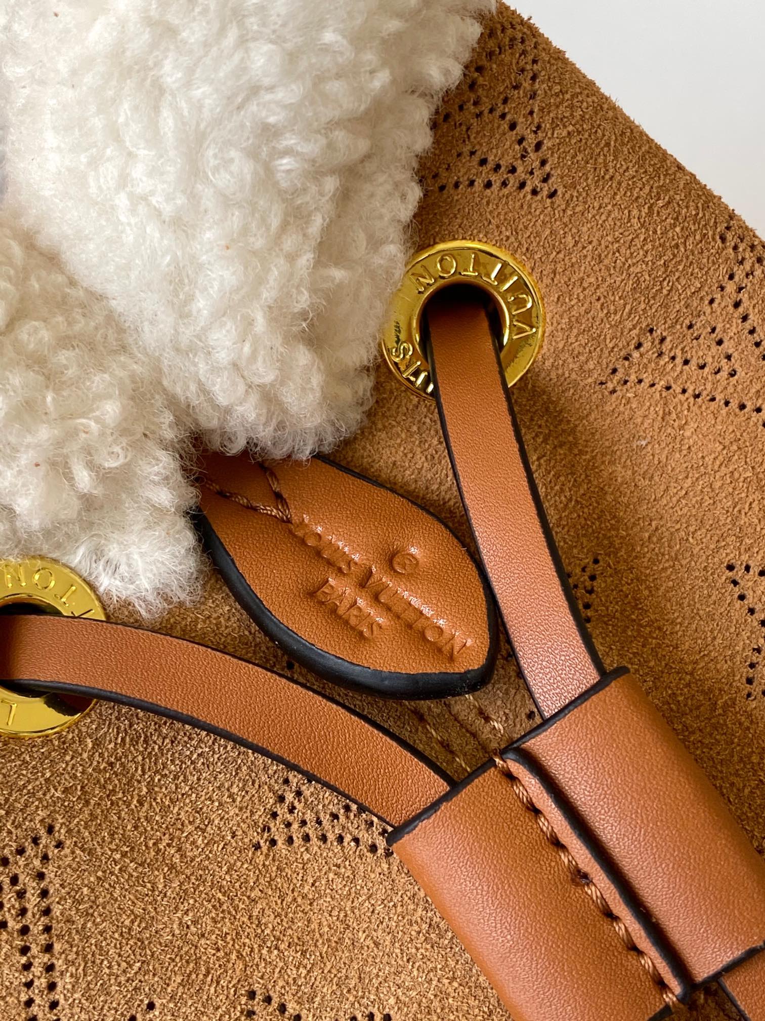 Louis Vuitton Camel Monogram Embossed Bucket Bag with Shearling Trim and Pouch