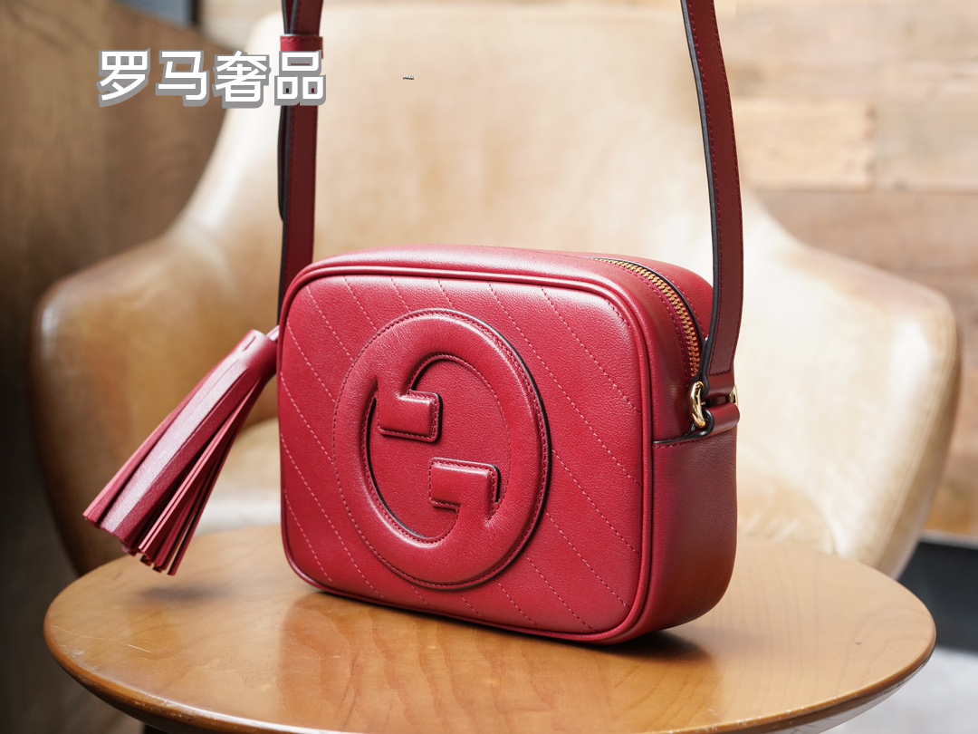 Gucci Red Leather Crossbody Camera Bag with Embossed Logo and Tassel