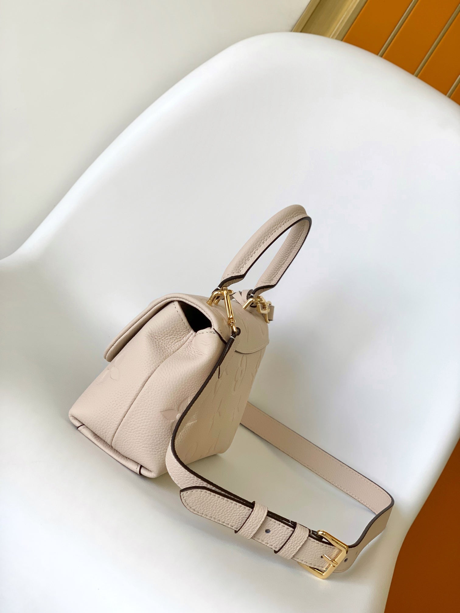 Louis Vuitton Elegant Cream Embossed Leather Top Handle Handbag with Shoulder Strap