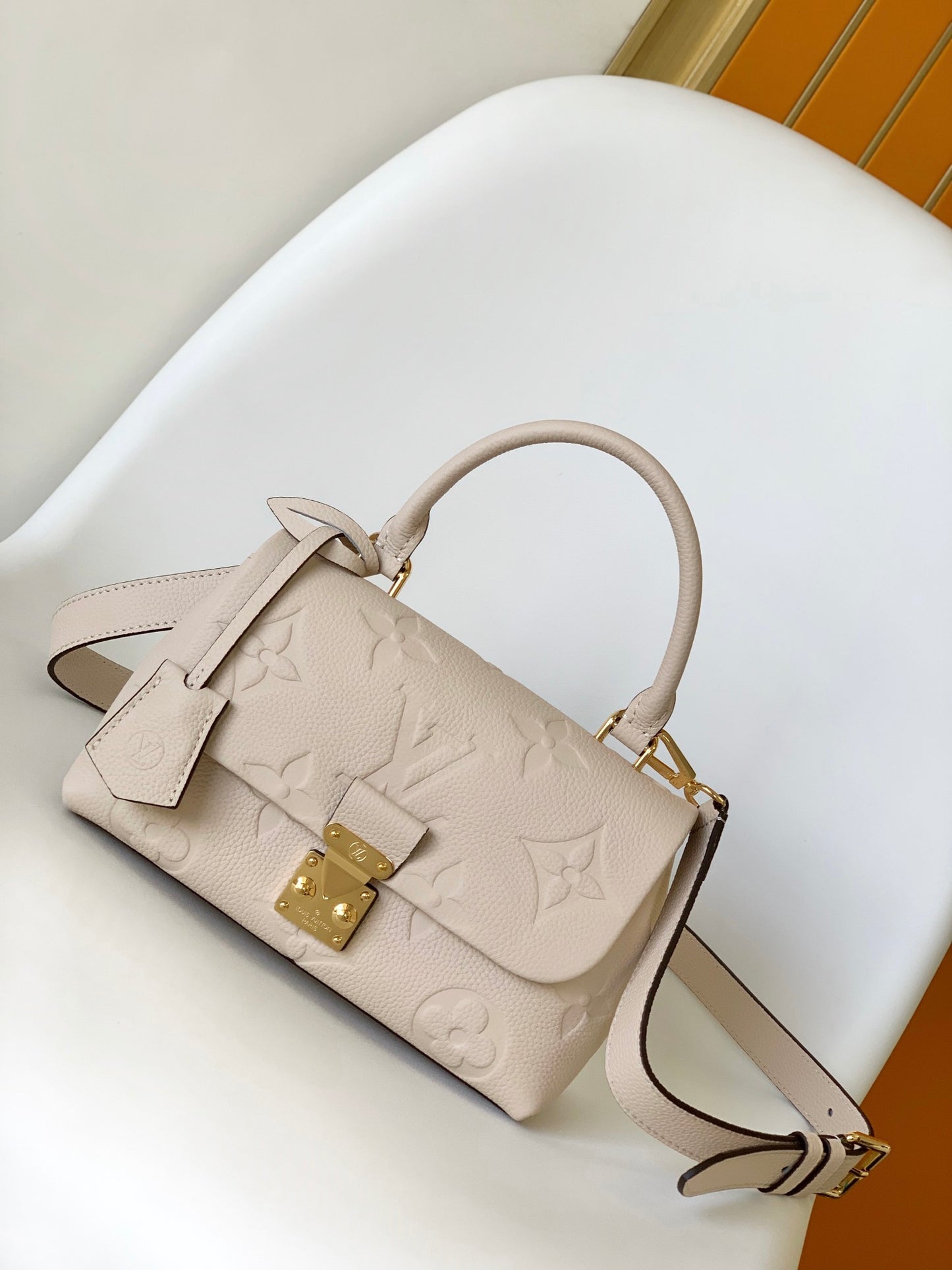 Louis Vuitton Elegant Cream Embossed Leather Top Handle Handbag with Shoulder Strap