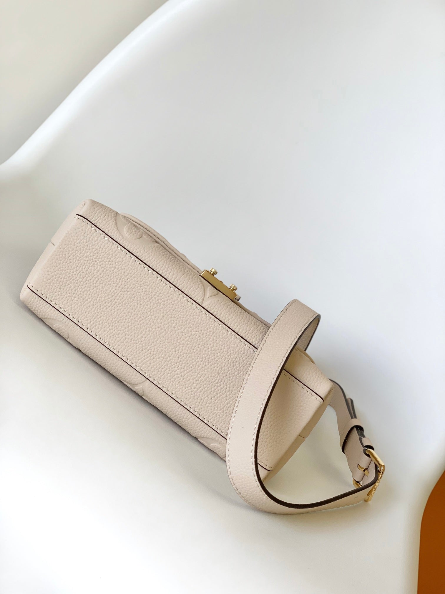 Louis Vuitton Elegant Cream Embossed Leather Top Handle Handbag with Shoulder Strap