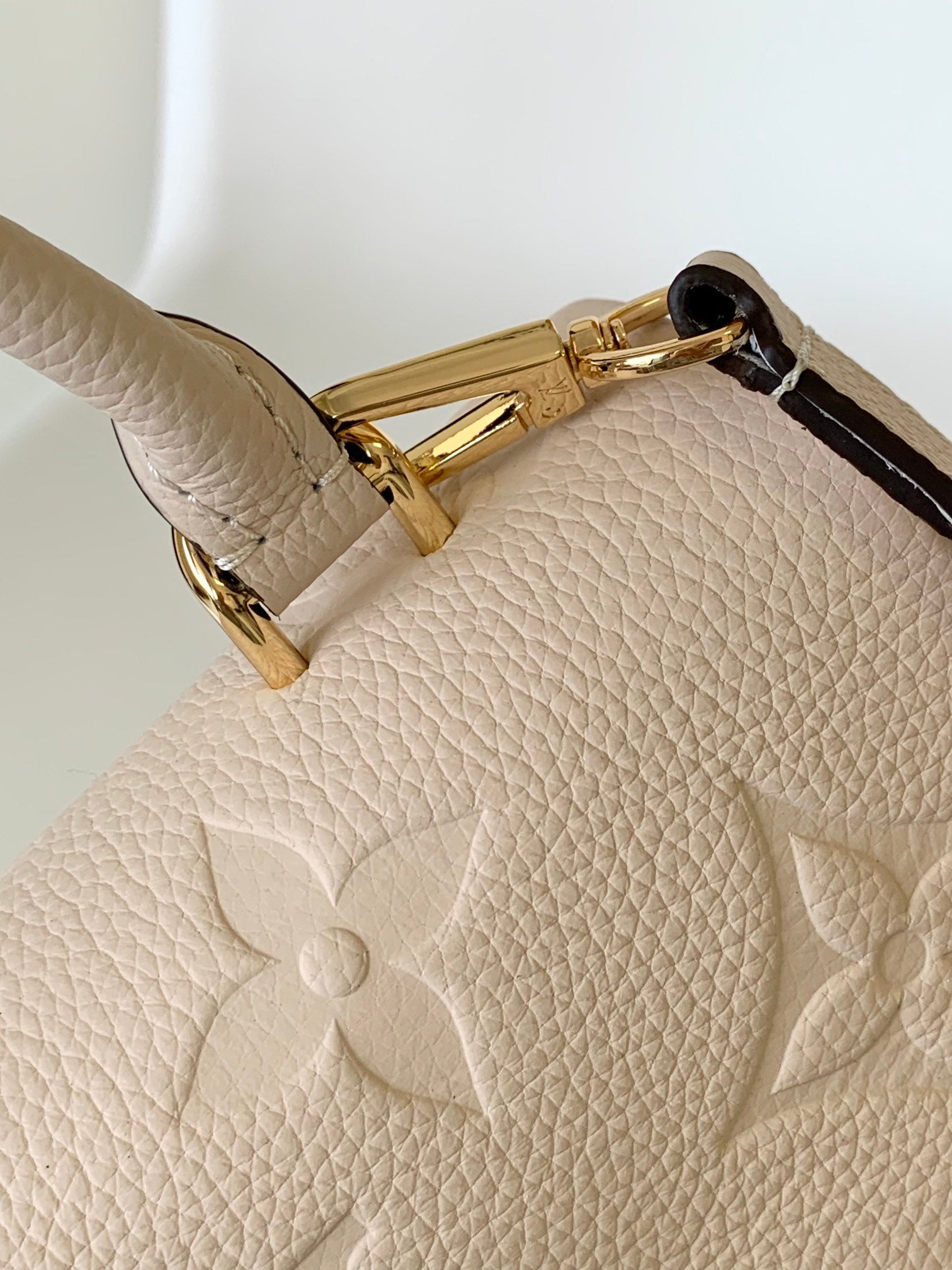 Louis Vuitton Elegant Cream Embossed Leather Top Handle Handbag with Shoulder Strap