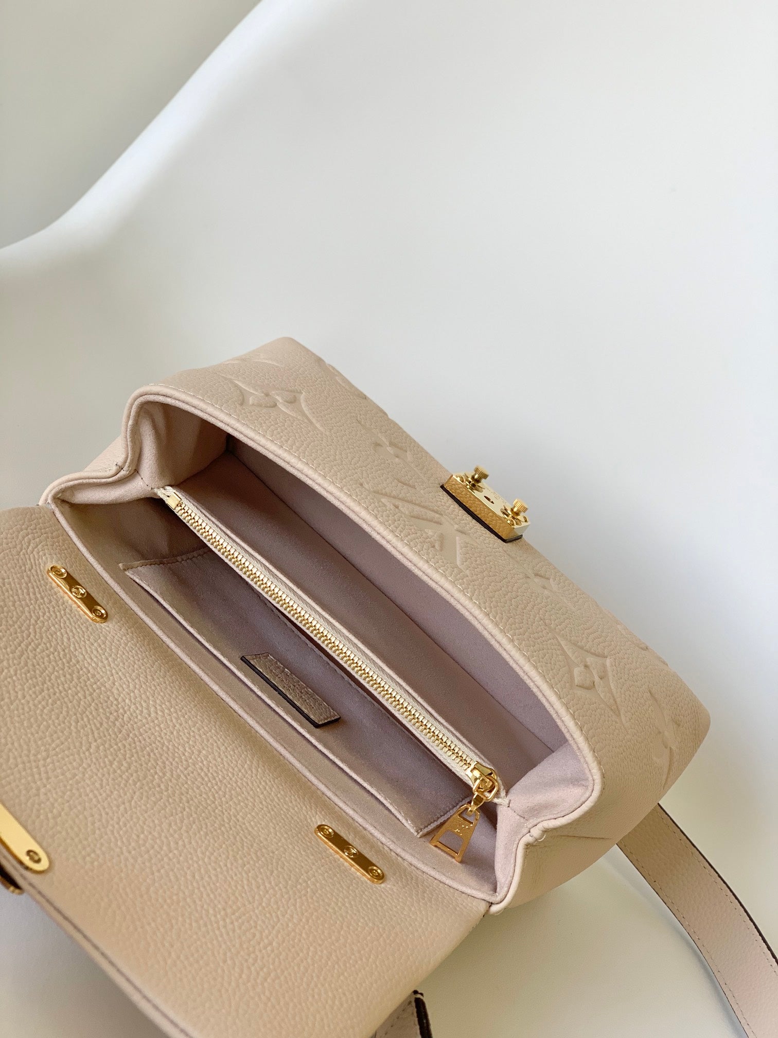 Louis Vuitton Elegant Cream Embossed Leather Top Handle Handbag with Shoulder Strap