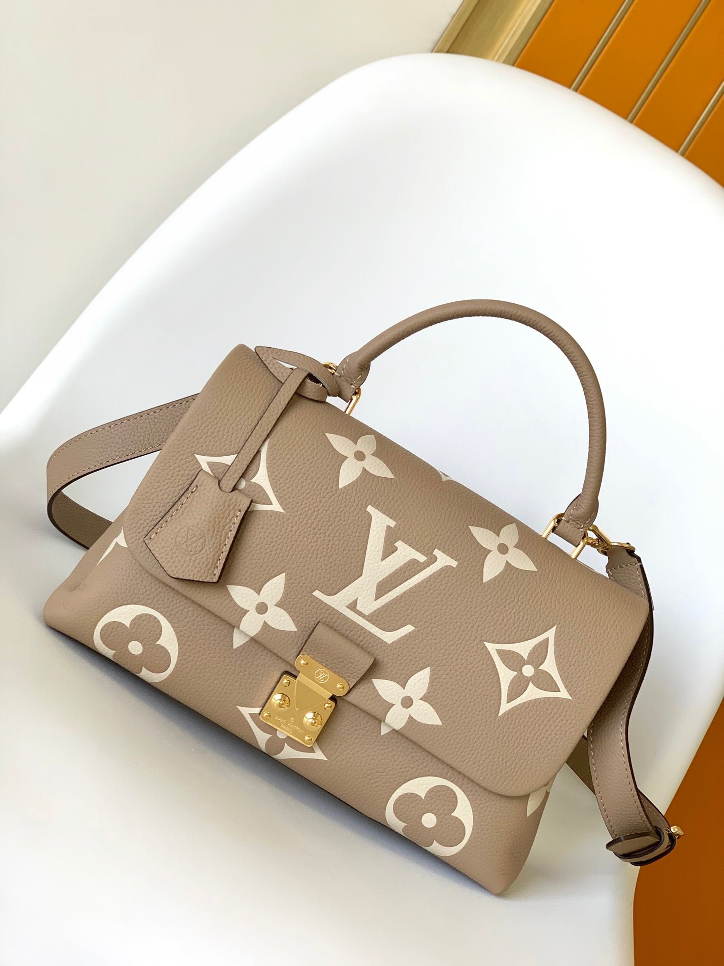 Louis Vuitton Elegant Beige Monogram Embossed Leather Top Handle Handbag