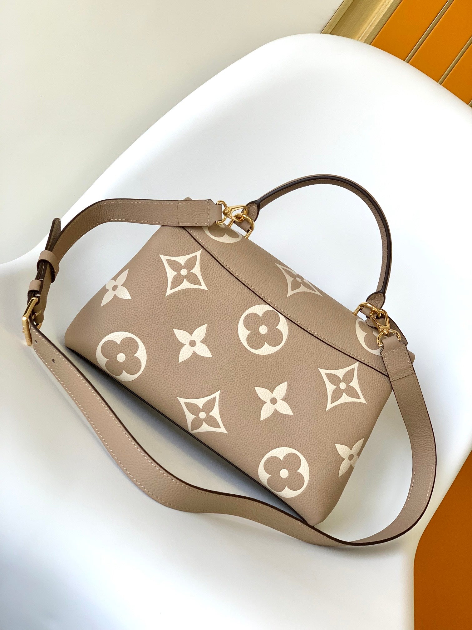 Louis Vuitton Elegant Beige Monogram Embossed Leather Top Handle Handbag