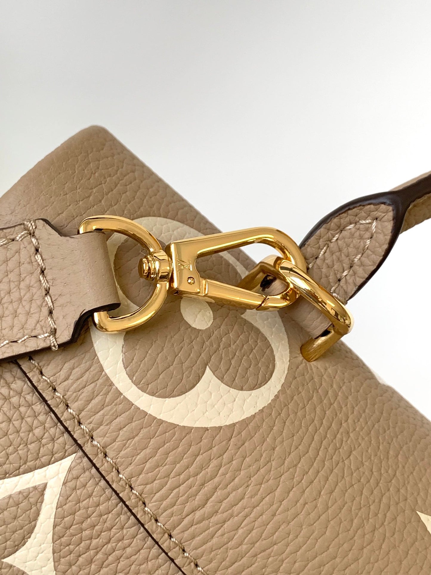 Louis Vuitton Elegant Beige Monogram Embossed Leather Top Handle Handbag