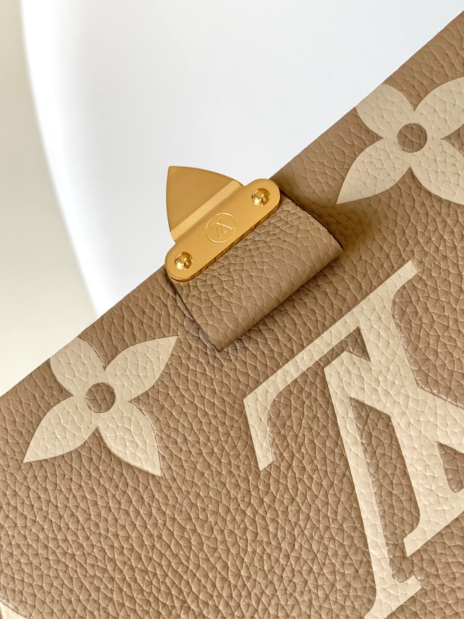 Louis Vuitton Elegant Beige Monogram Embossed Leather Top Handle Handbag