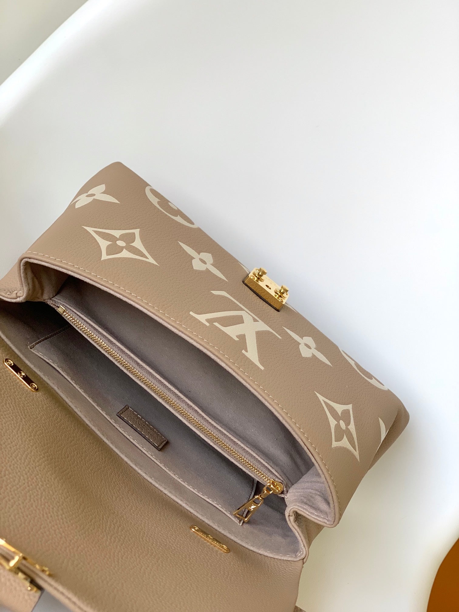 Louis Vuitton Elegant Beige Monogram Embossed Leather Top Handle Handbag