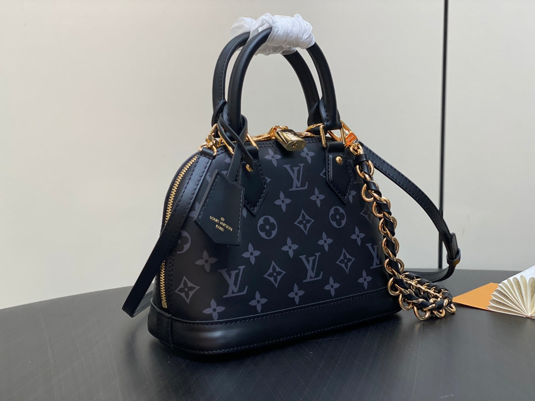 Louis Vuitton Elegant Black Embossed Leather Dome Satchel with Gold Chain