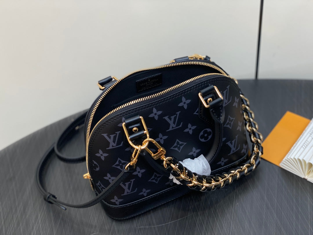 Louis Vuitton Elegant Black Embossed Leather Dome Satchel with Gold Chain