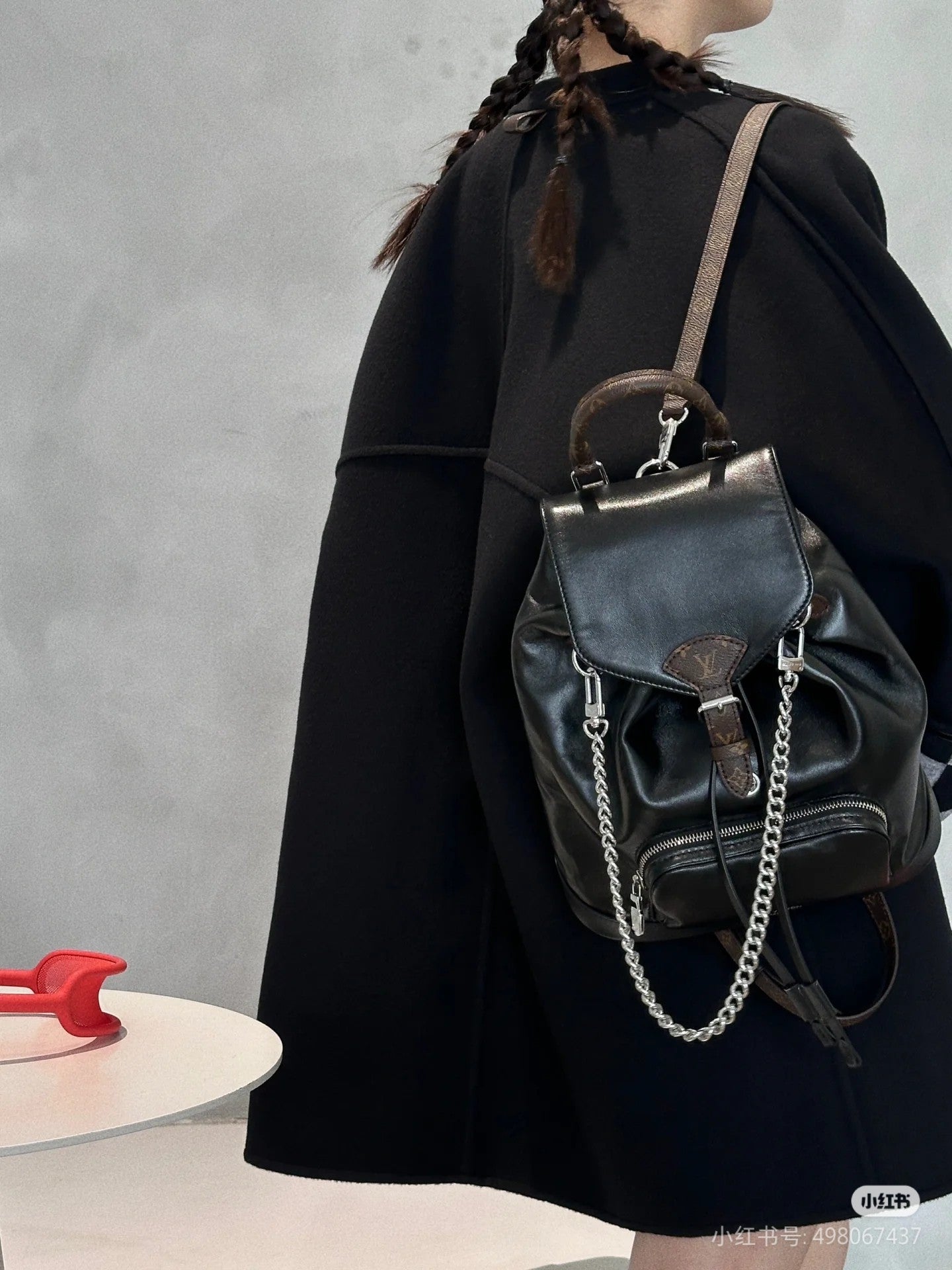 Louis Vuitton Black Leather Drawstring Backpack with Silver Chain Accent