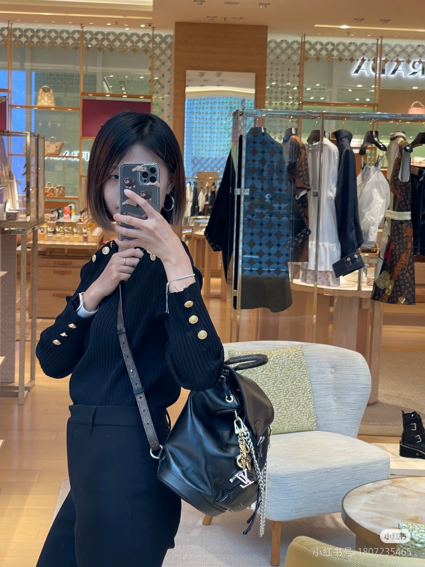 Louis Vuitton Black Leather Drawstring Backpack with Silver Chain Accent