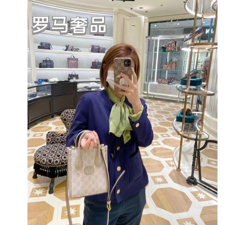 Gucci Elegant Cream Monogram Mini Tote Bag with Top Handles and Crossbody Strap