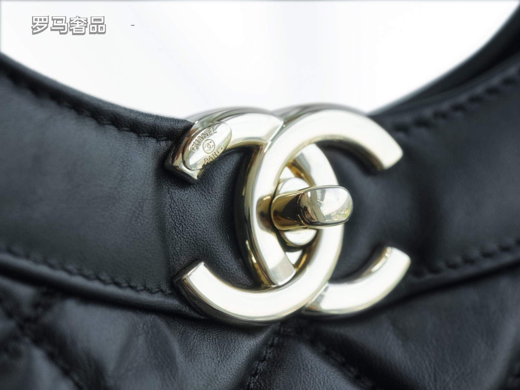 Luxury Black Quilted Leather Handbag with Gold-Tone Chain Strap and Cut-Out Handles