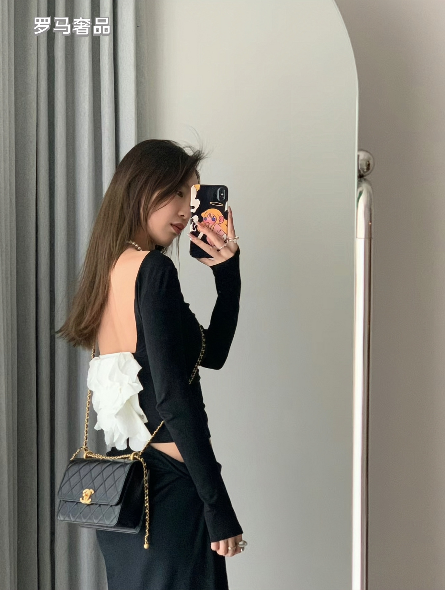 Chanel Black Quilted Lambskin Mini Flap Bag with Gold-Tone Hardware