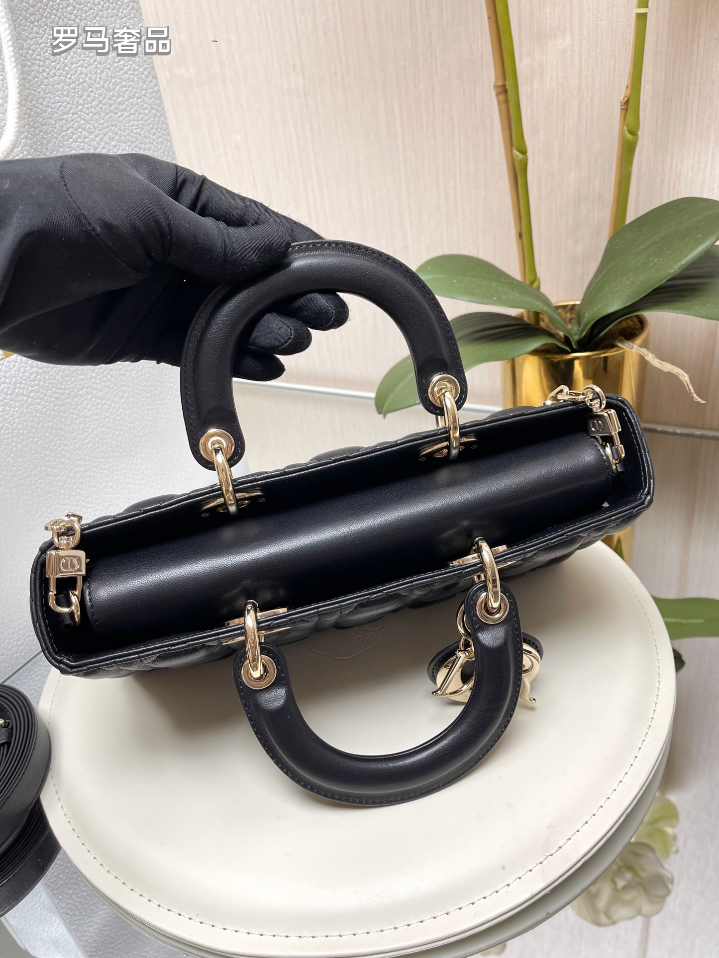 Dior Black Quilted Leather Handbag with Top Handle and Gold Chain Strap