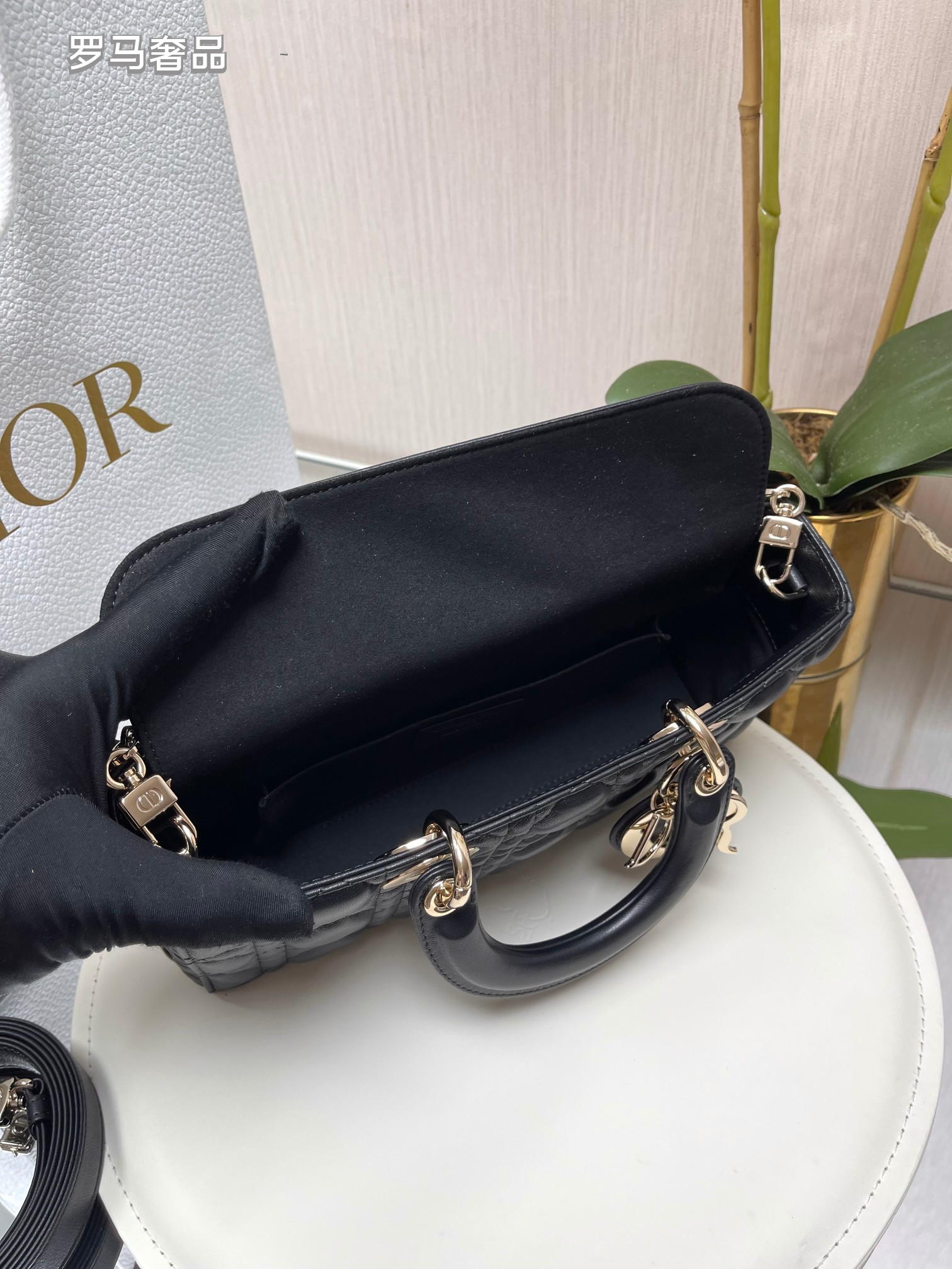 Dior Black Quilted Leather Handbag with Top Handle and Gold Chain Strap