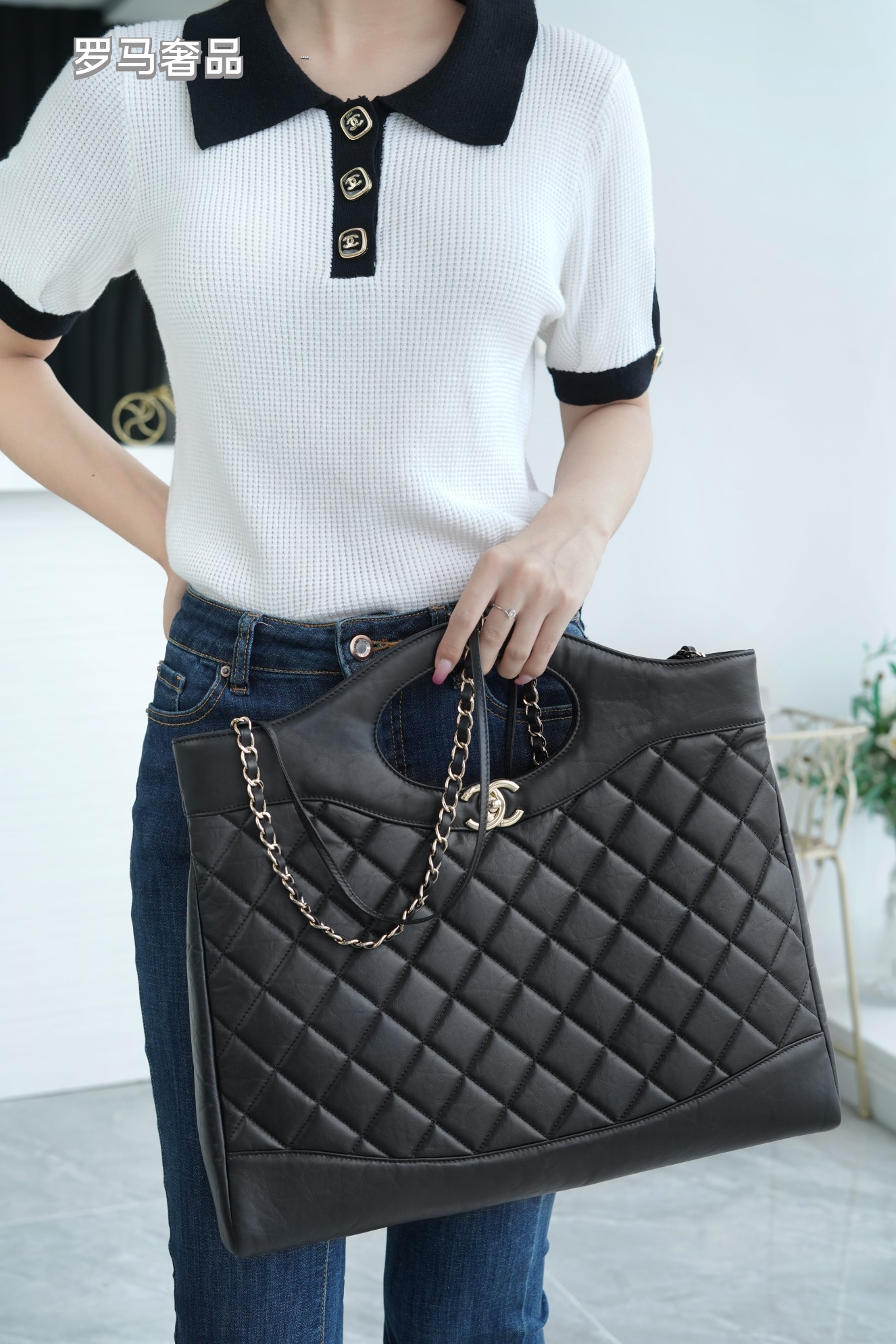 Luxury Black Quilted Leather Handbag with Gold-Tone Chain Strap and Cut-Out Handles