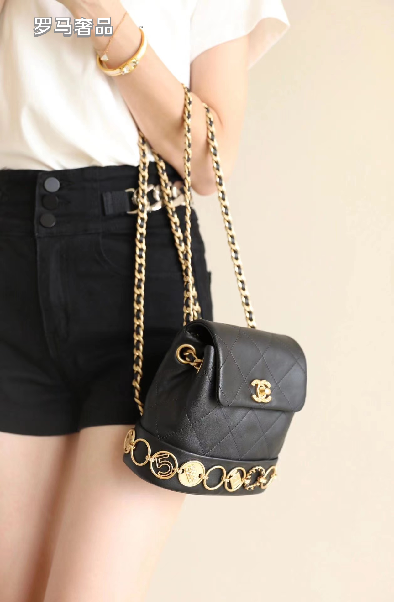 Chanel Vintage Mini Quilted Leather Backpack with Medallion Charm Chain Detail - Black/Gold