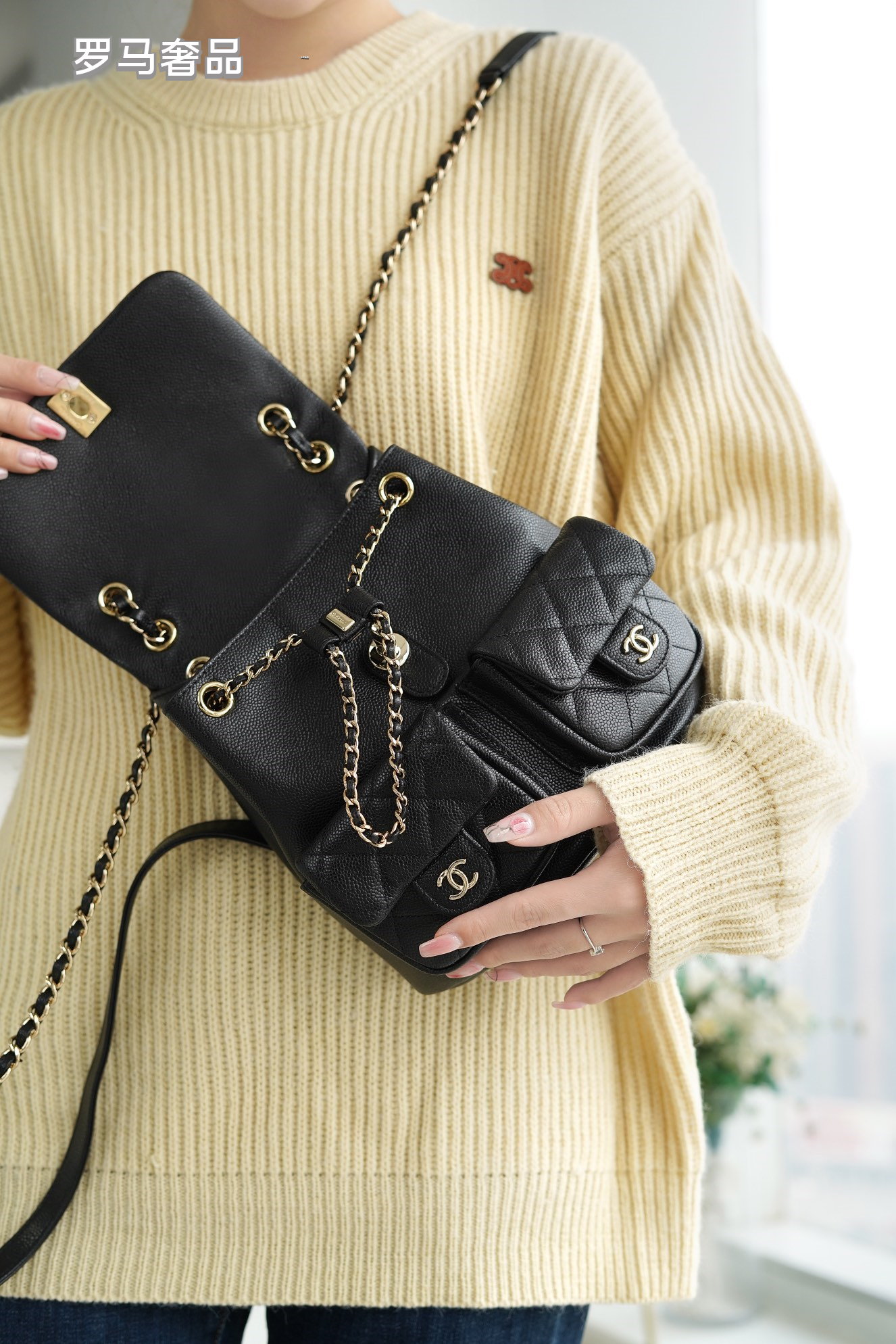 Black Quilted Leather Backpack with Gold-Tone Chain Straps