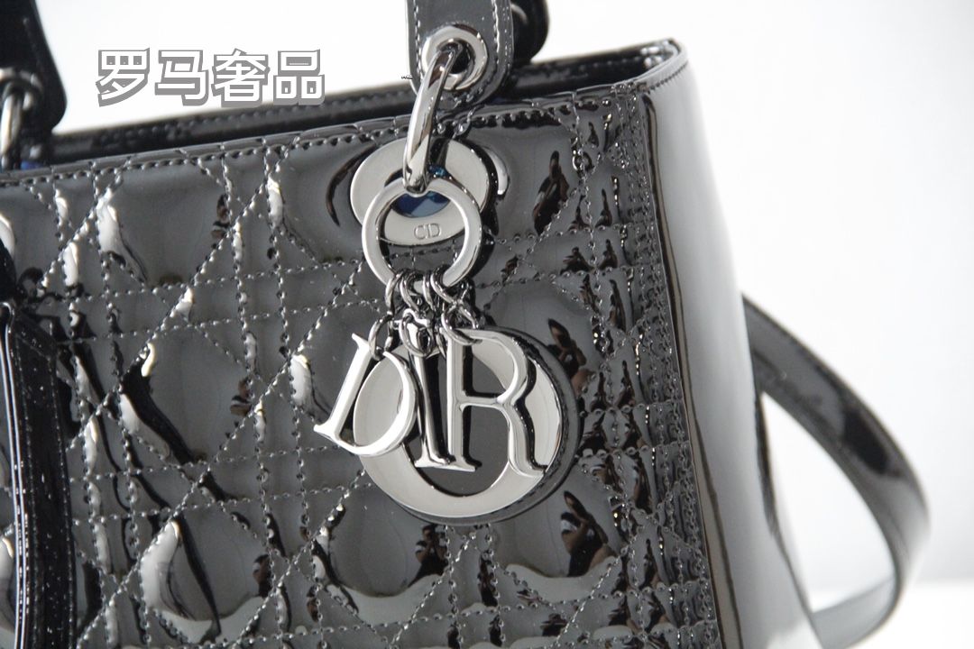 Elegant Black Quilted Top Handle Handbag with Gold-Tone Charms