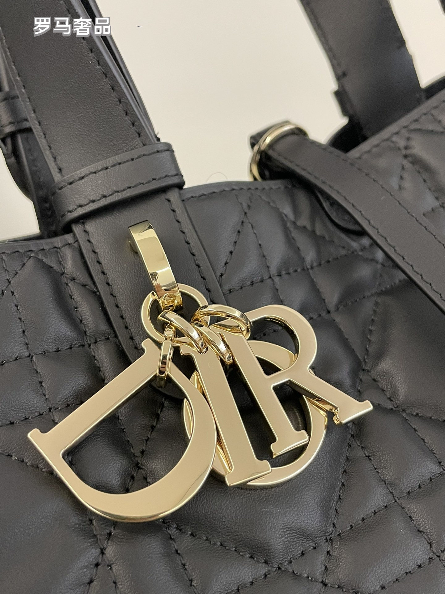 Dior Elegant Black Quilted Top Handle Handbag with Gold Letter Charms
