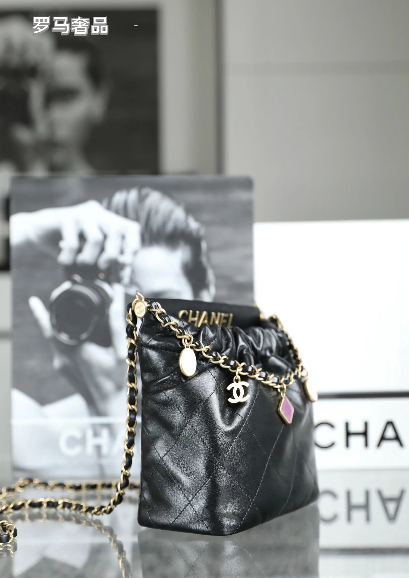 Chanel 22 Small Handbag Black Quilted Leather Gold-Tone Charms