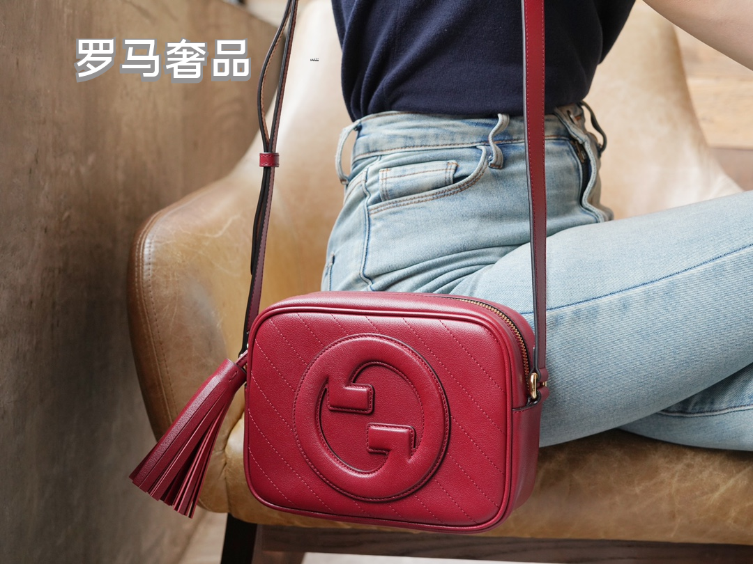 Gucci Red Leather Crossbody Camera Bag with Embossed Logo and Tassel