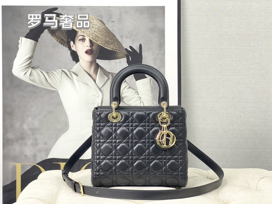 Elegant Black Quilted Top Handle Handbag with Gold-Tone Charms