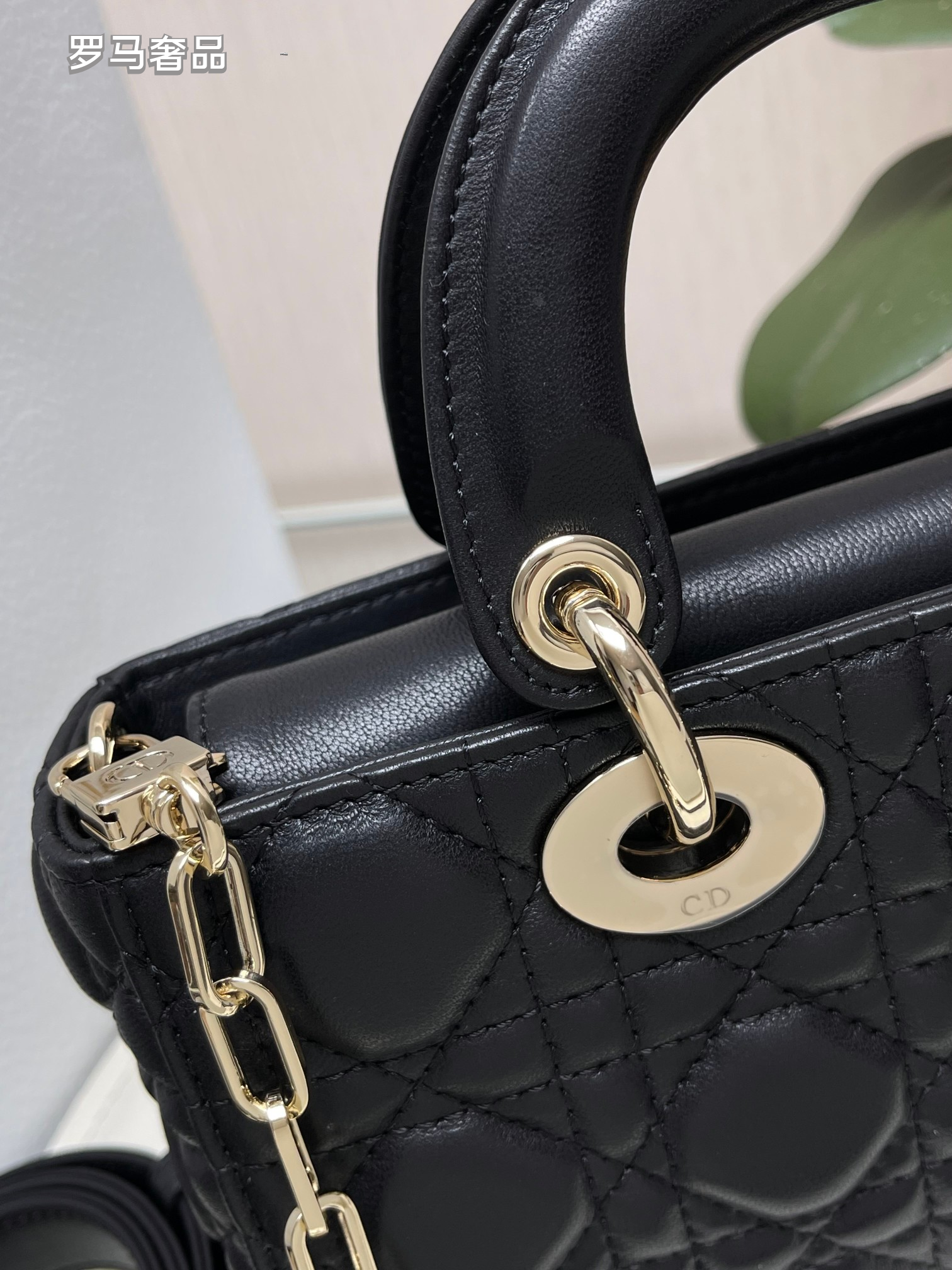 Dior Black Quilted Leather Handbag with Top Handle and Gold Chain Strap
