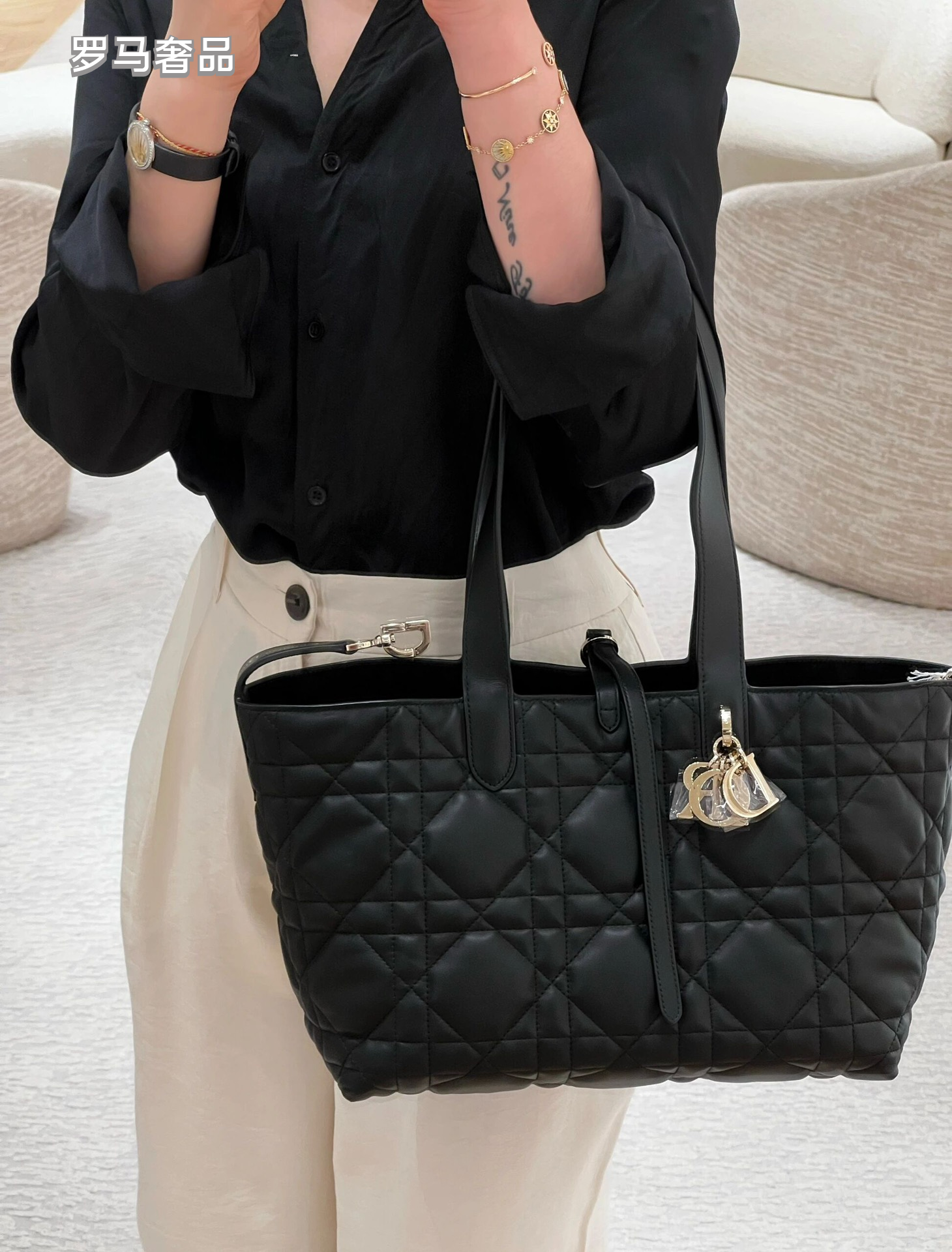 Dior Elegant Black Quilted Top Handle Handbag with Gold Letter Charms
